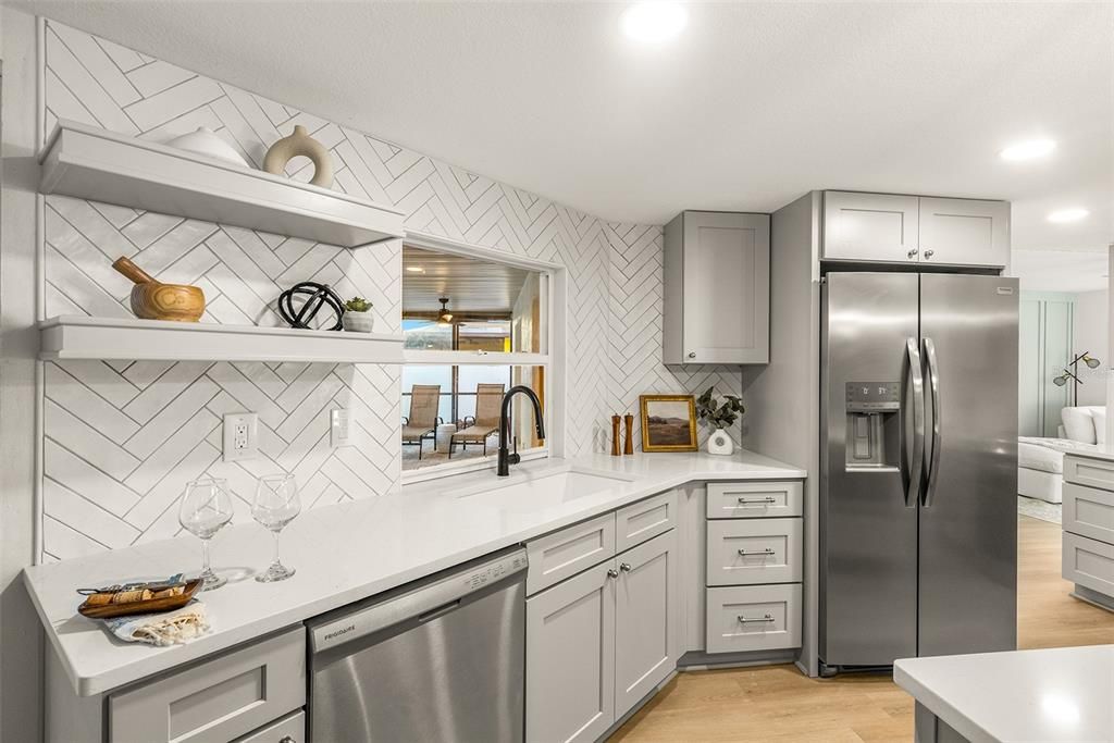 Custom Kitchen with herringbone tile backsplash