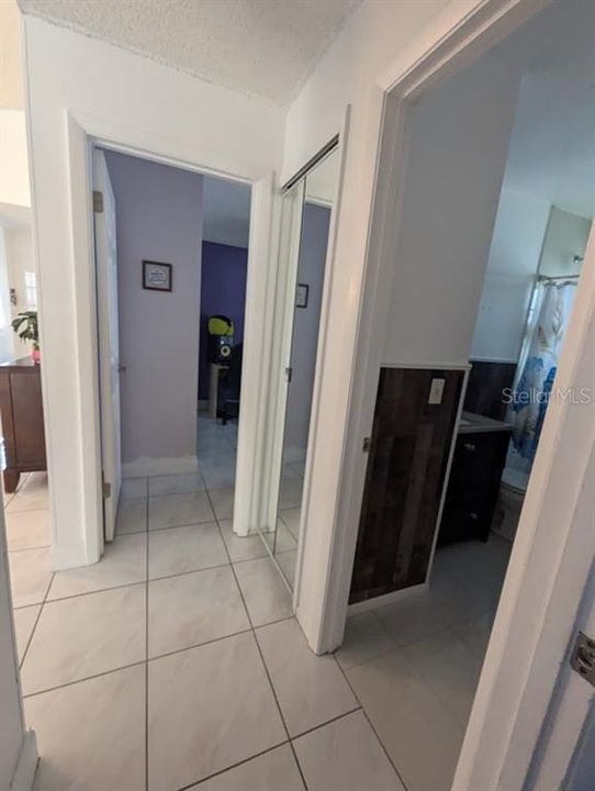 hallway. View of Bedroom 1 and guest bathroom