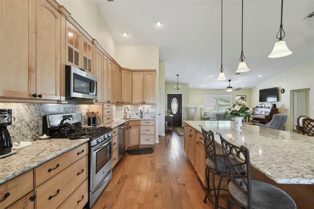 Lovely wooden kitchen with upgrades in cabinets, full length.