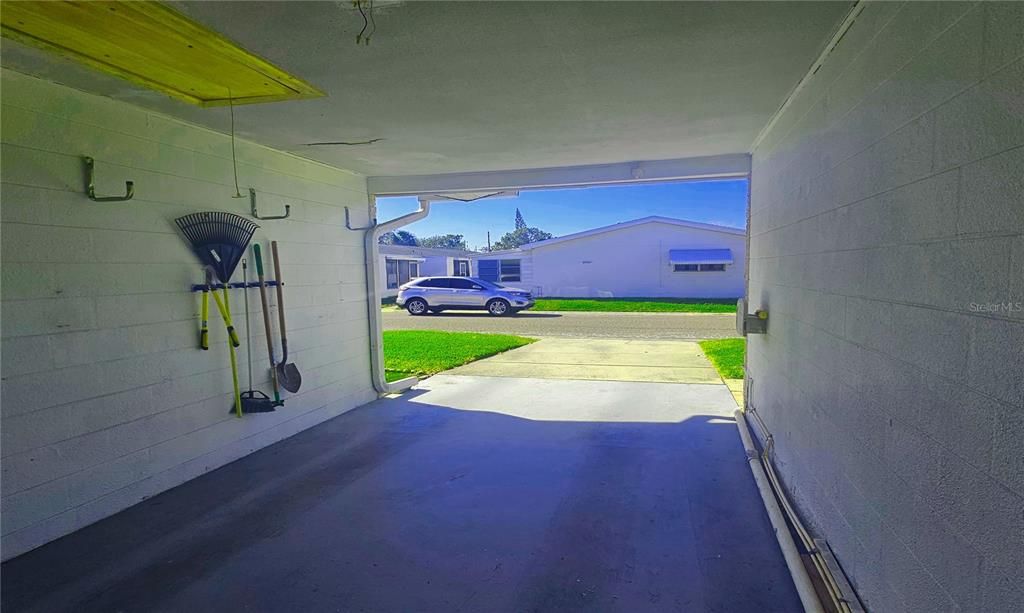 Carport with extra storage.