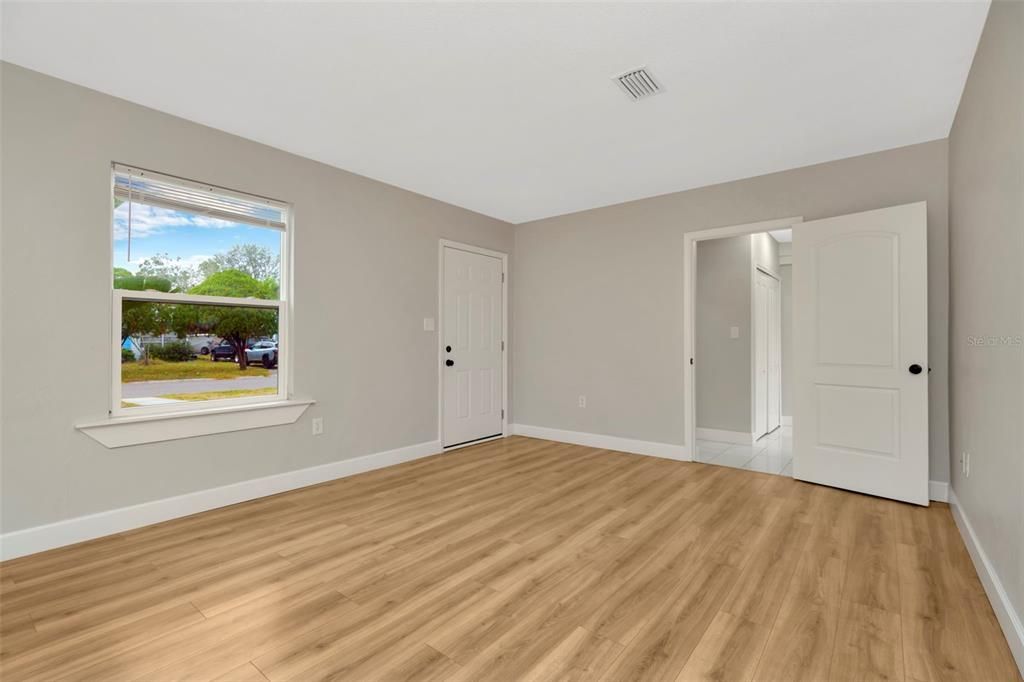 Living room with entry to the primary suite