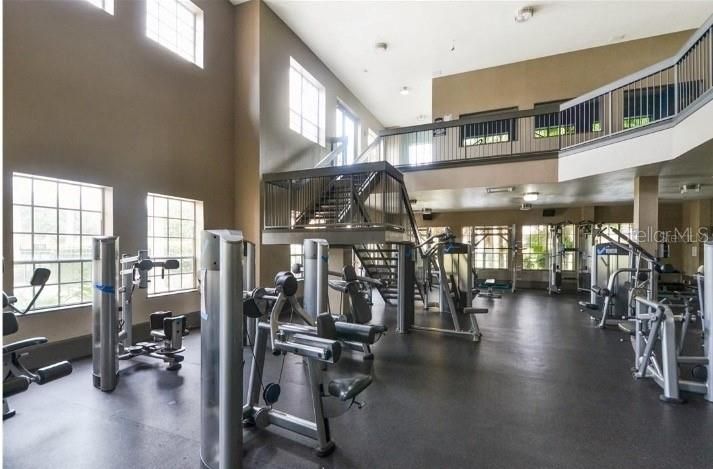 Fitness center overlooking pool and walkable from this condo