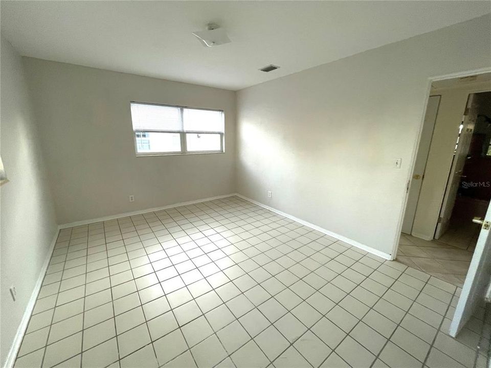 Larger bedroom looking from the living room door entrance.  this room has 2 door entrances.