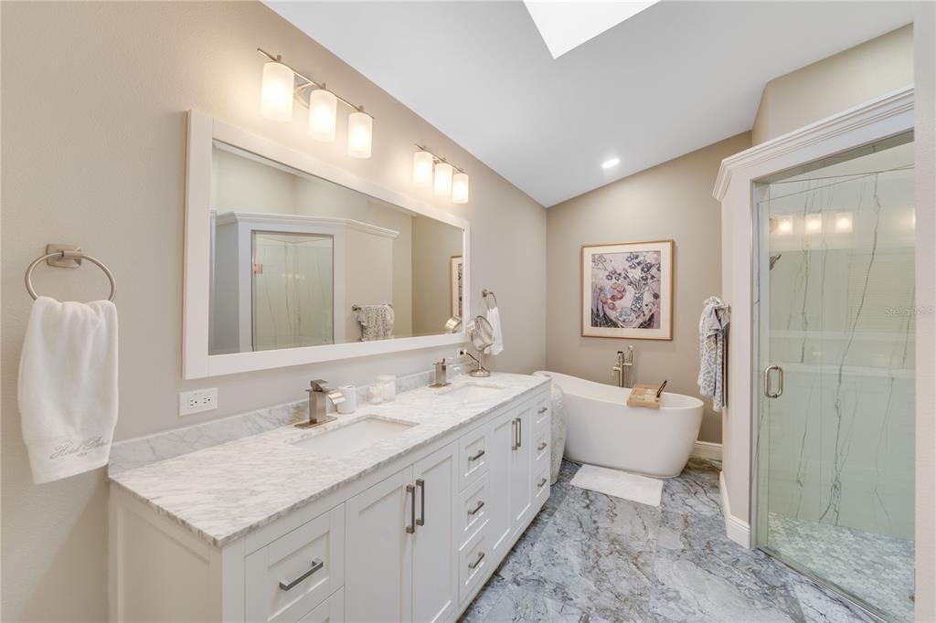 Main en-suite with soaking tub, large walk in shower and beautiful tile work