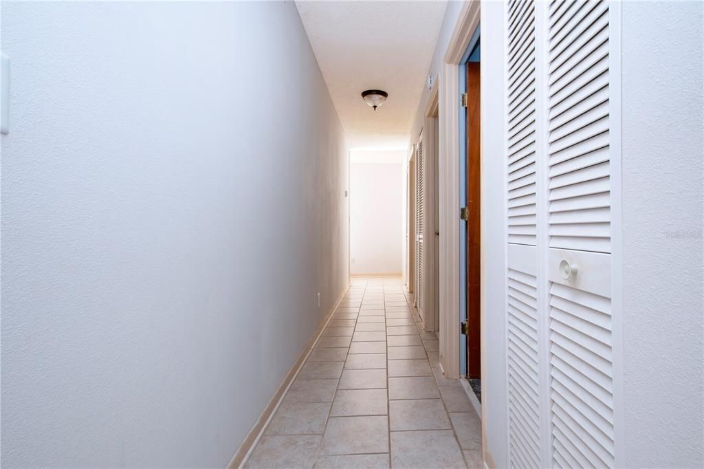 Hallway to 2 other bedrooms and 2nd bathroom