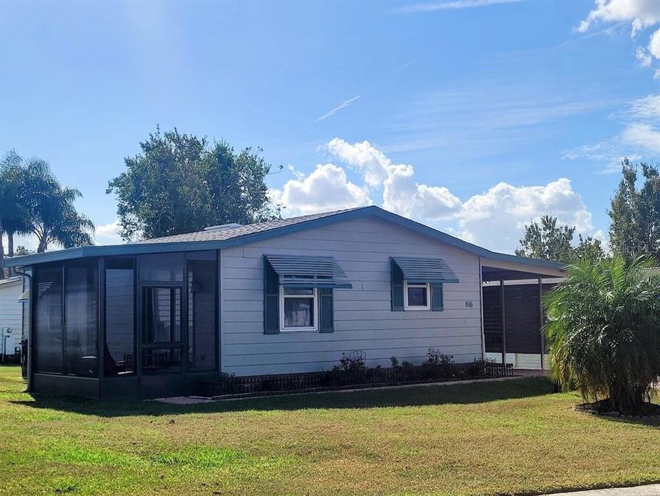 Nicely landscaped home with side Flordia screen room