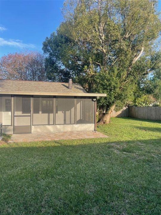 View of covered porch from back yard