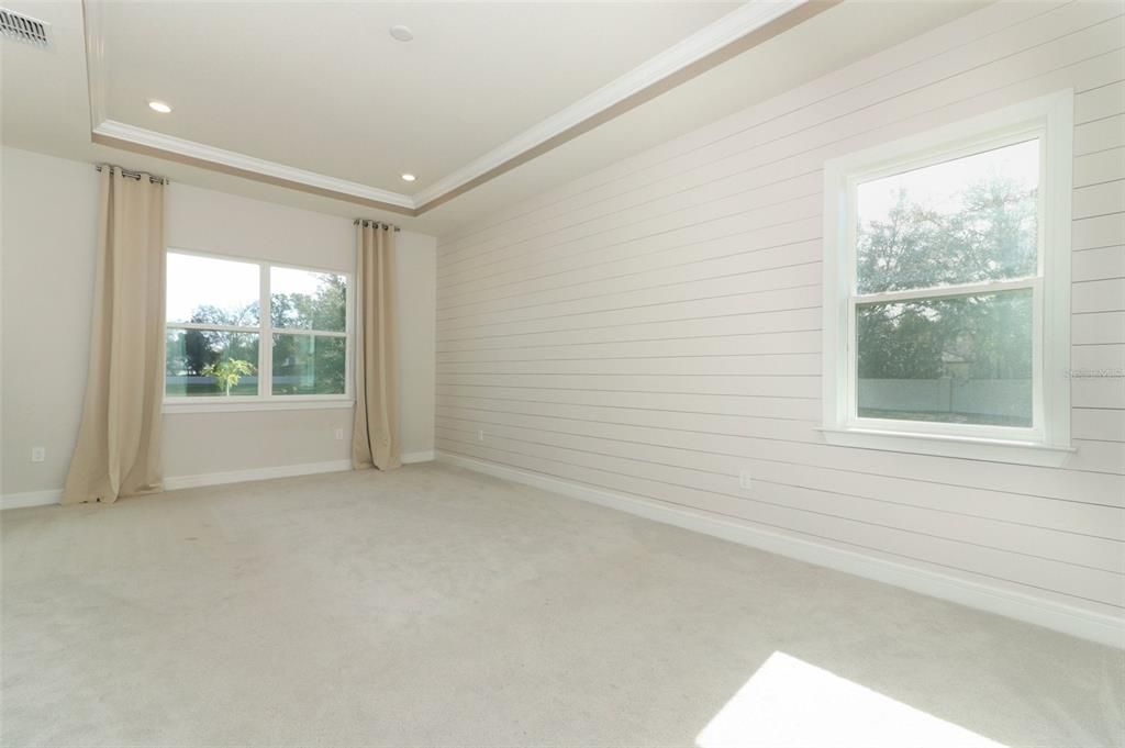 Primary bedroom overlooking back yard.