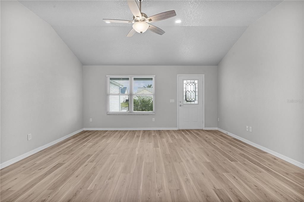 View dining room to living room and front door