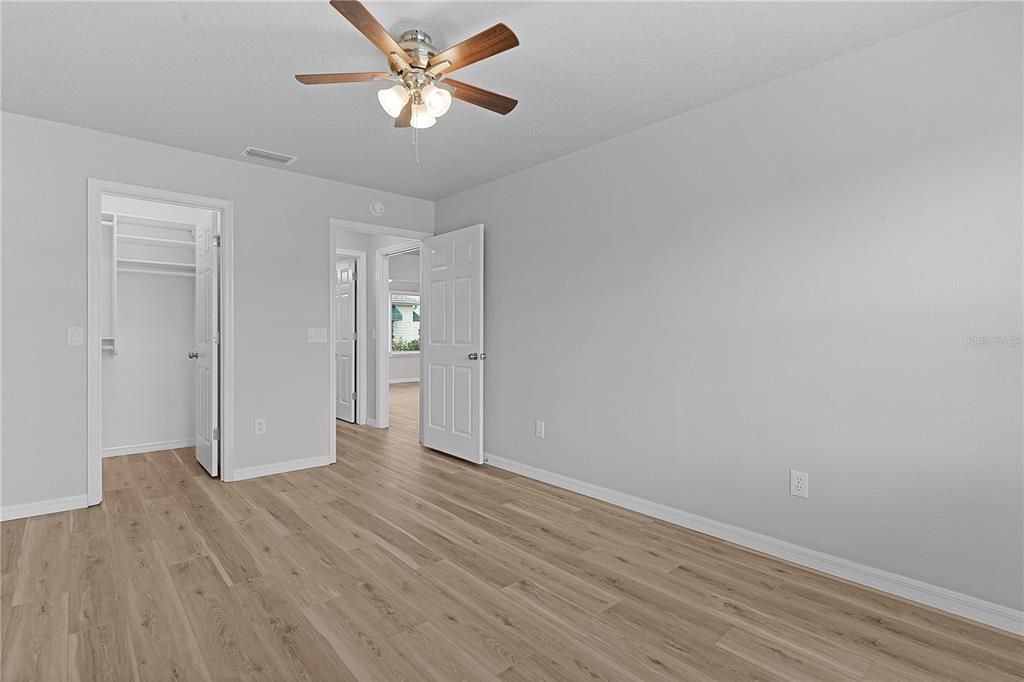 2nd bedroom walk in closet with organization