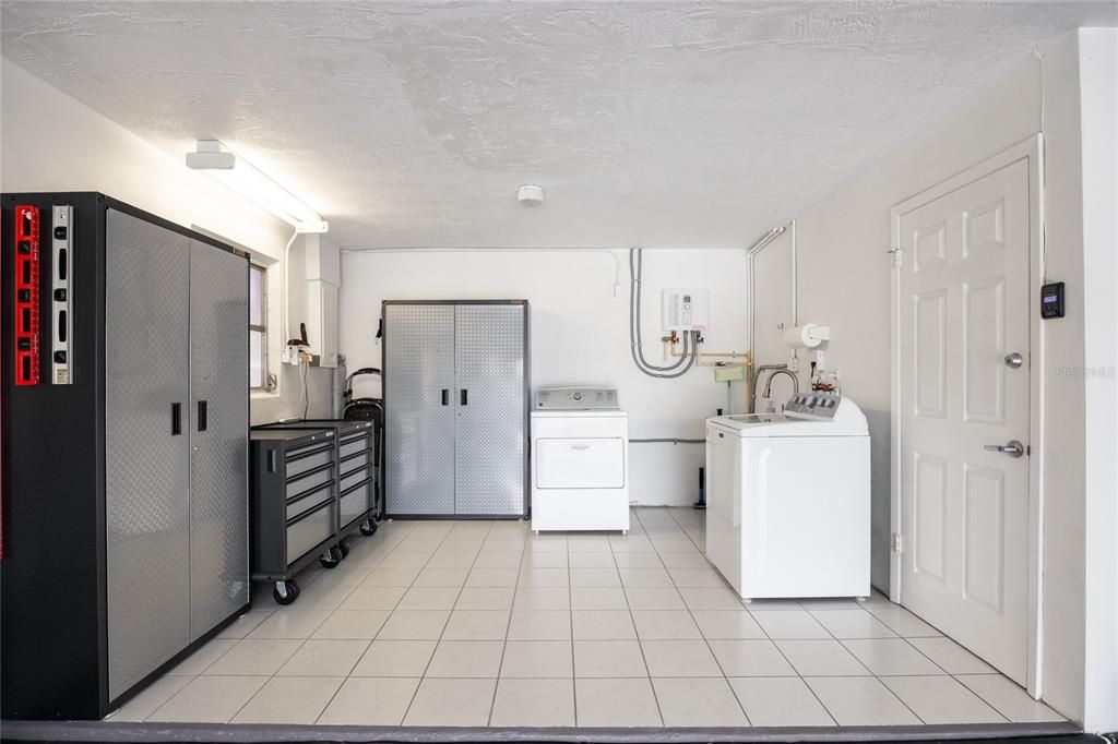 Not only does this garage have room for 2 cars, it also has a large laundry and work area!