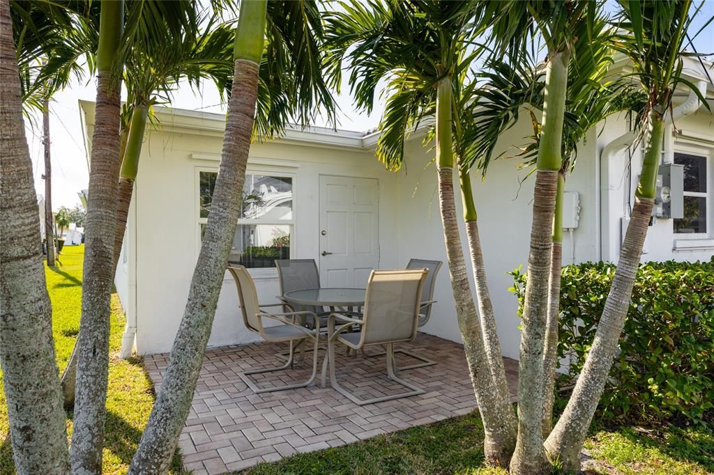 The back patio area is finished with brick paver stones and is accessible from the Family Room.   Surrounded by beautiful palm trees you will know you are in Florida when you are out here!