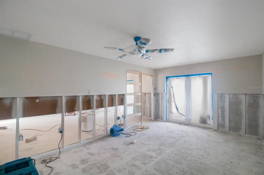 Primary bedroom with private hurricane slider entrance to the pool.