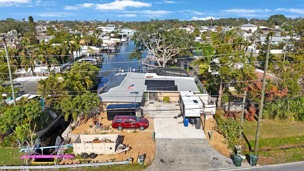 Large oversized driveway. The home is located on a canal.