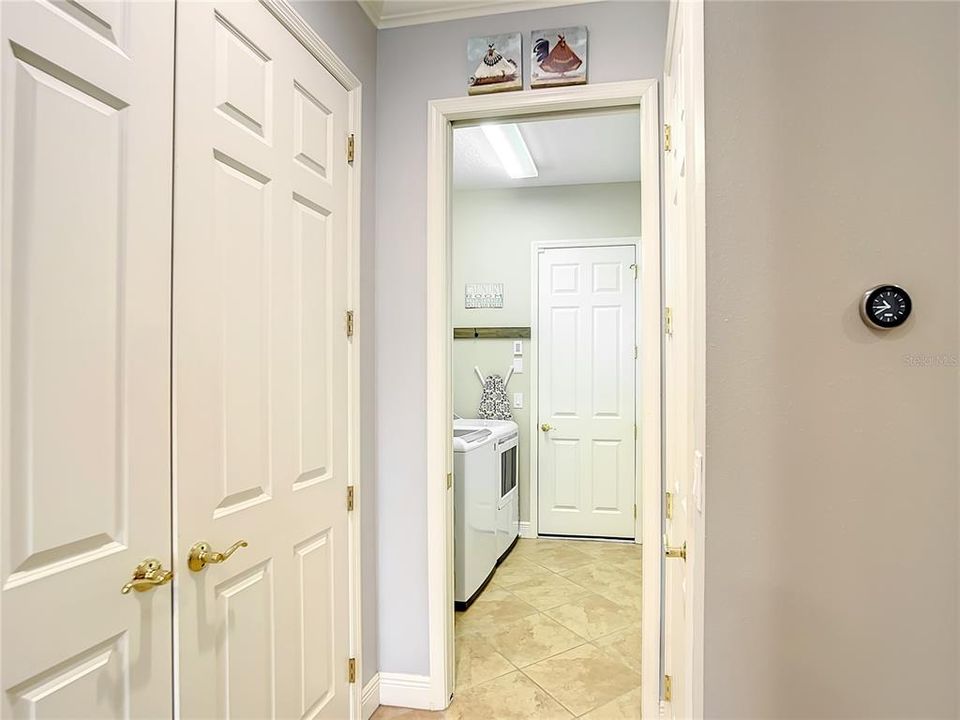 Large pantry looking into laundry room