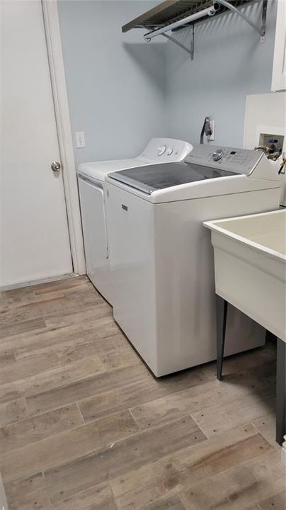 laundry with sink and storage