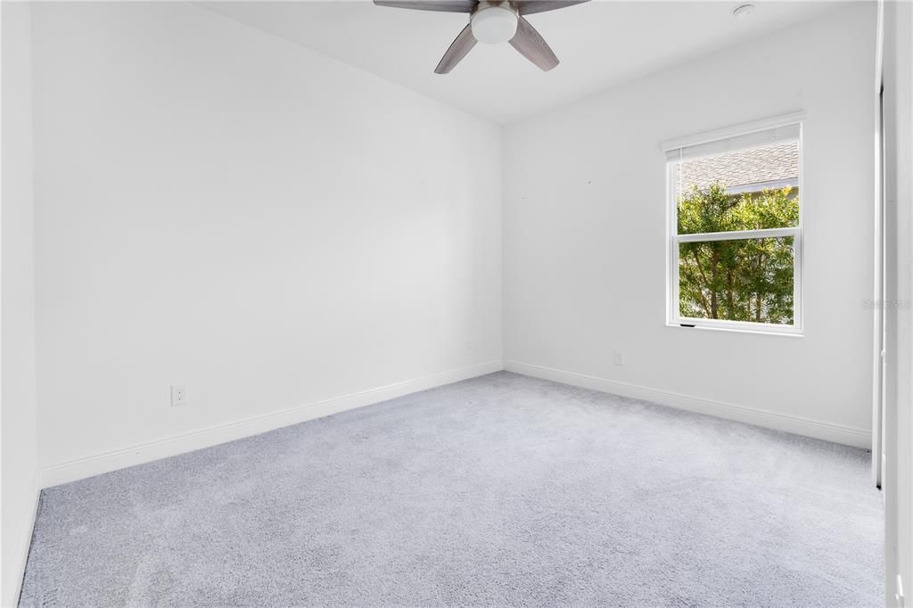 2nd bedroom with carpeted floor