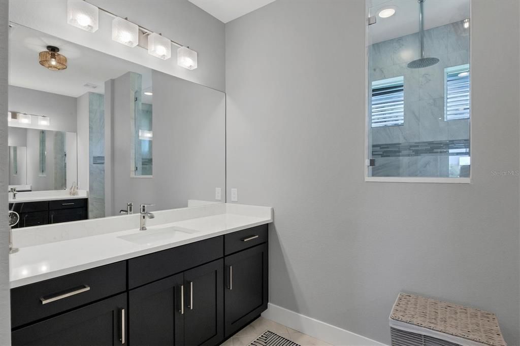 Sleek, Spa-inspired Primary Bath Featuring Modern Finishes