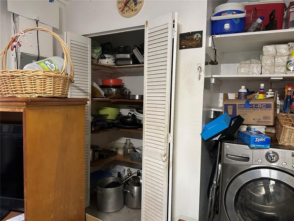 Garage storage closet next to washer and dryer