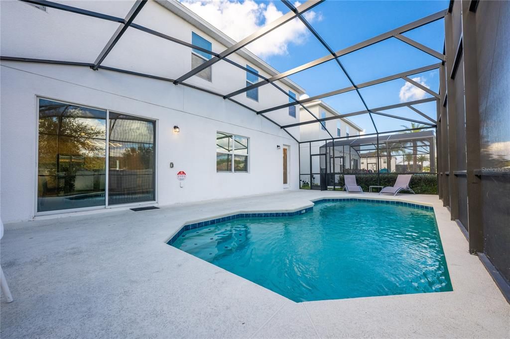 In addition to an OPEN CONCEPT main floor, your choice of TWO PRIMARY SUITES (one up and one down), upgraded kitchen and contemporary design features, this home is perfectly situated within this 24 HOUR GUARD GATED COMMUNITY rich with RESORT STYLE AMENITIES.