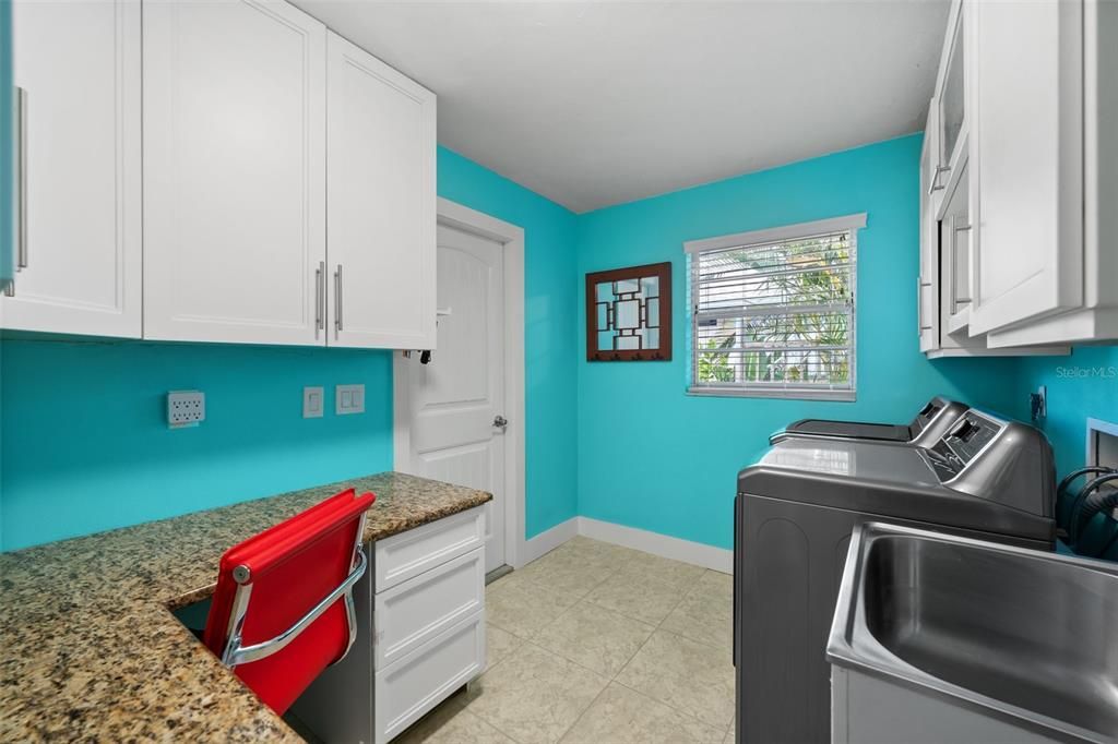 Laundry room with built-in desk and Laundry Tub