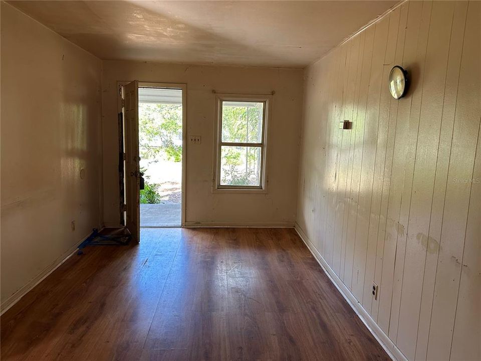 DOWNSTAIRS UNIT LIVING ROOM AND FRONT DOOR