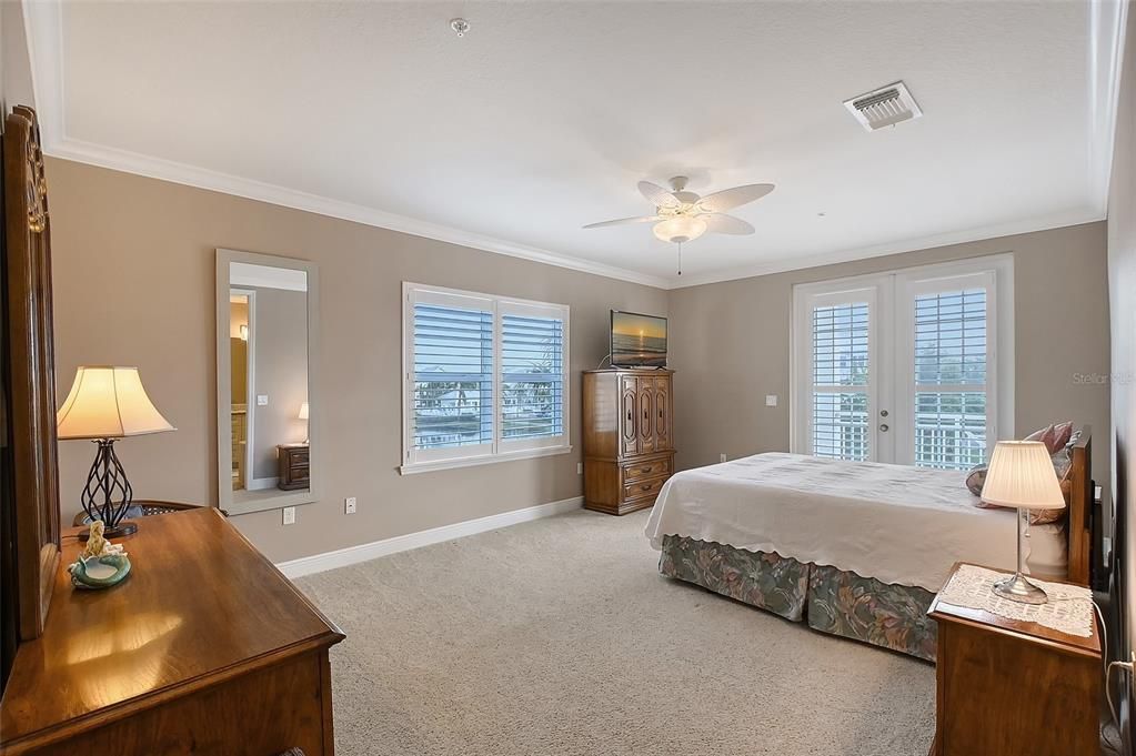 large primary bedroom with balcony