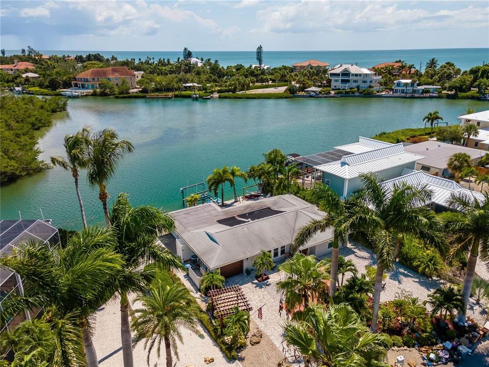 Picture of the protected cove, to your left is the ICW. Deep water for sailboats and larger power boats. Manatees and dolphin love this area as there is very very little boat traffic. Take notice of the amazing royal palms in the front, back and sides.