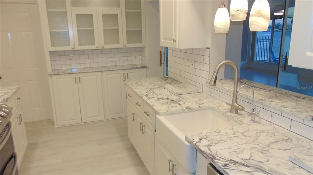 Kitchen after new flooring and paint, brand new Kitchen Appliances have been ordered and are to be installed on 1/7/25.