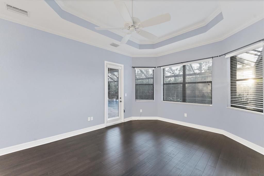 Primary bedroom with door to pool/lanai