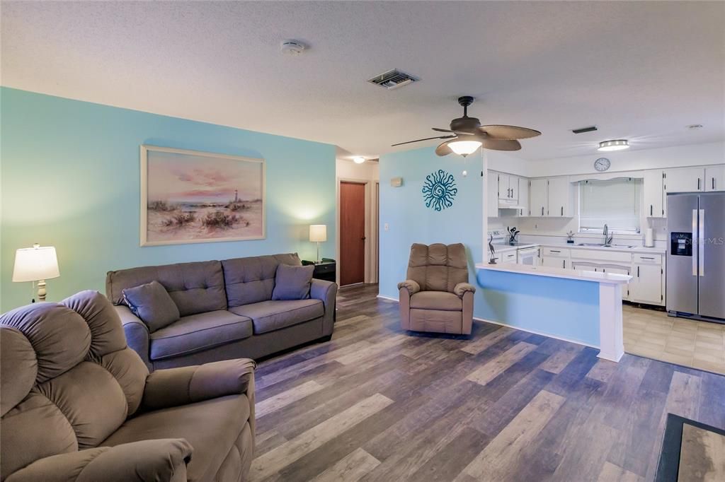 Living Room with Ceiling Fan and TV