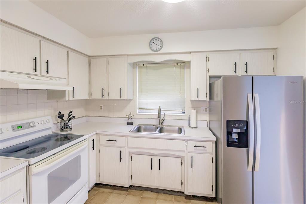 Kitchen with Stainless Steel Fridge