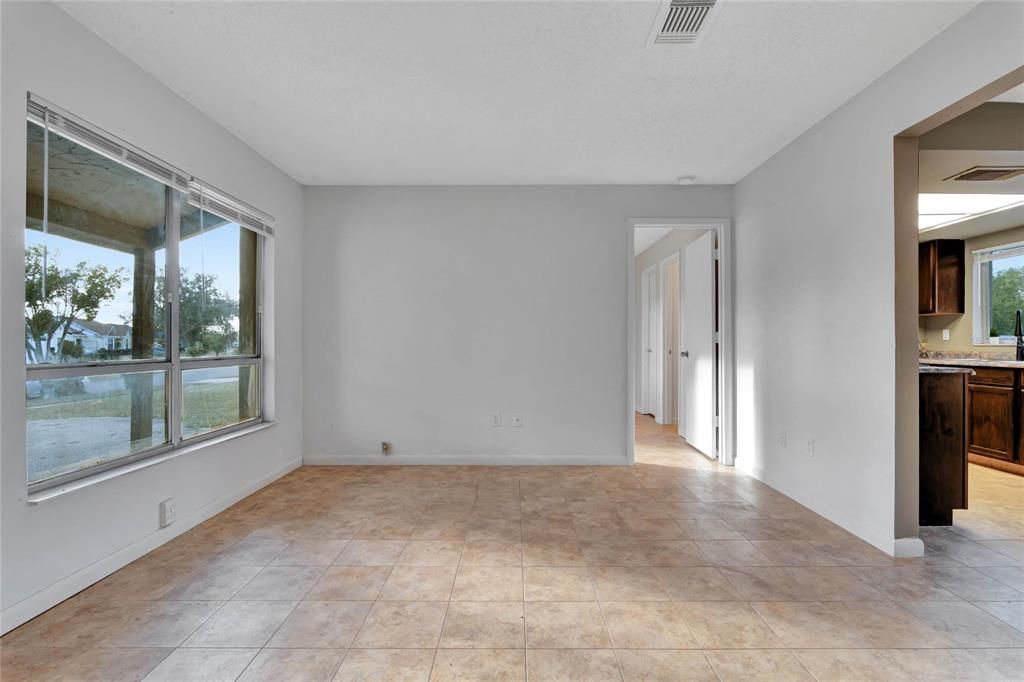 Living Room w/ Door to Primary Bedroom & Front of House