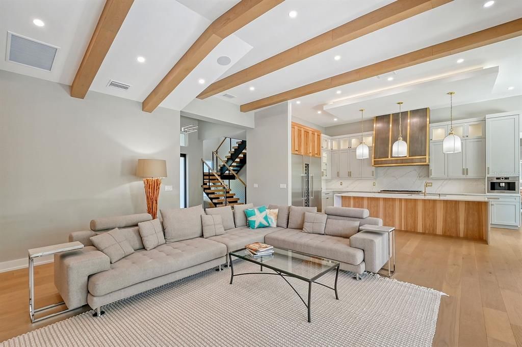 Property was built with the finest materials including natural wood beams and finishes which draw the eye upward, accentuating the ceiling height and airy feel.