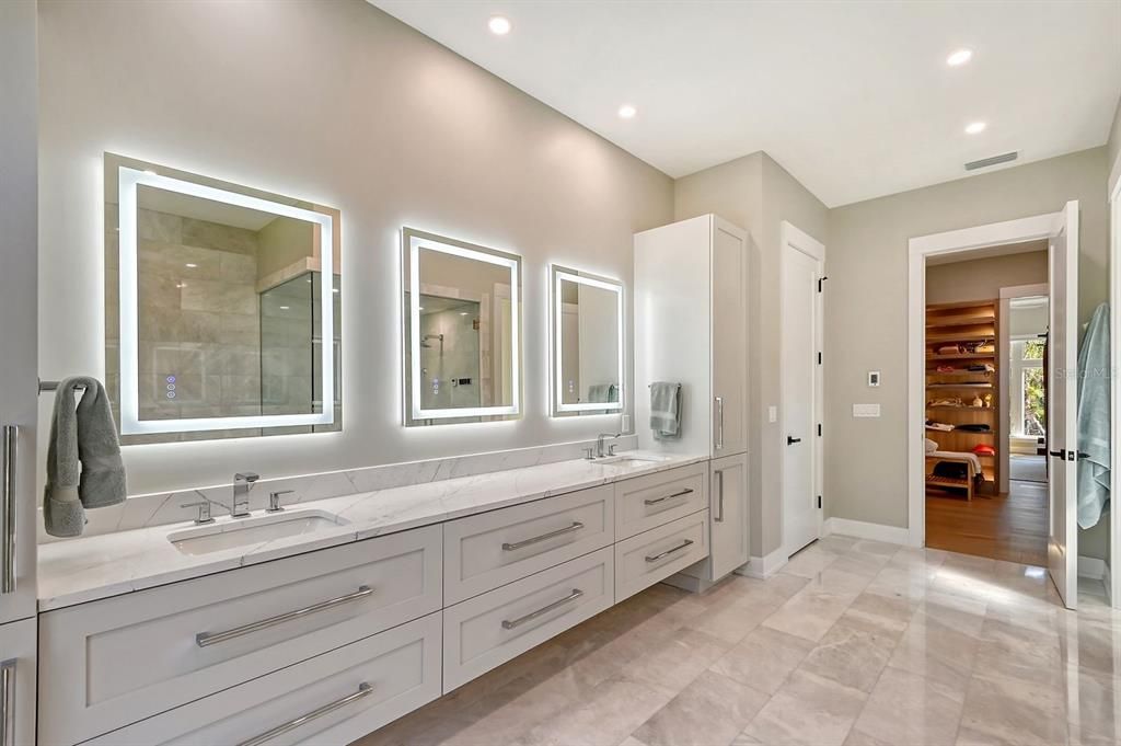 Large vanity offers storage galore with built in cabinets and a closet.