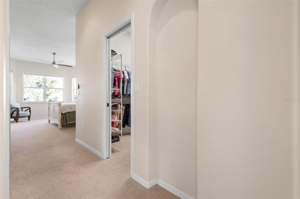 Primary bedroom with walk-in closet