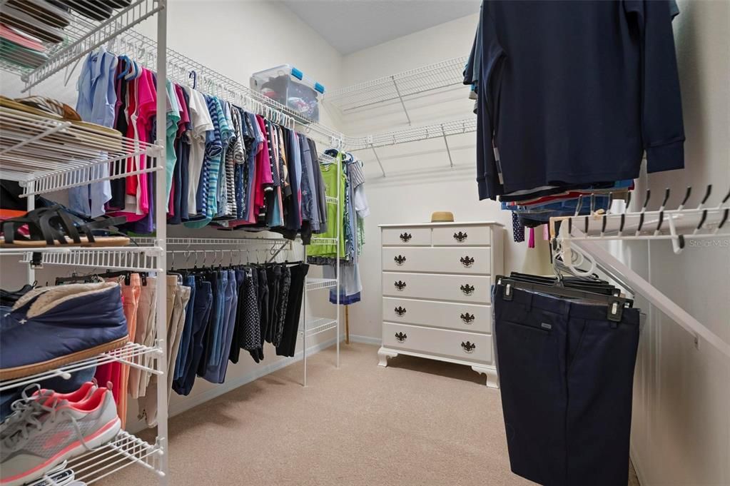 Primary bedroom walk-in closet