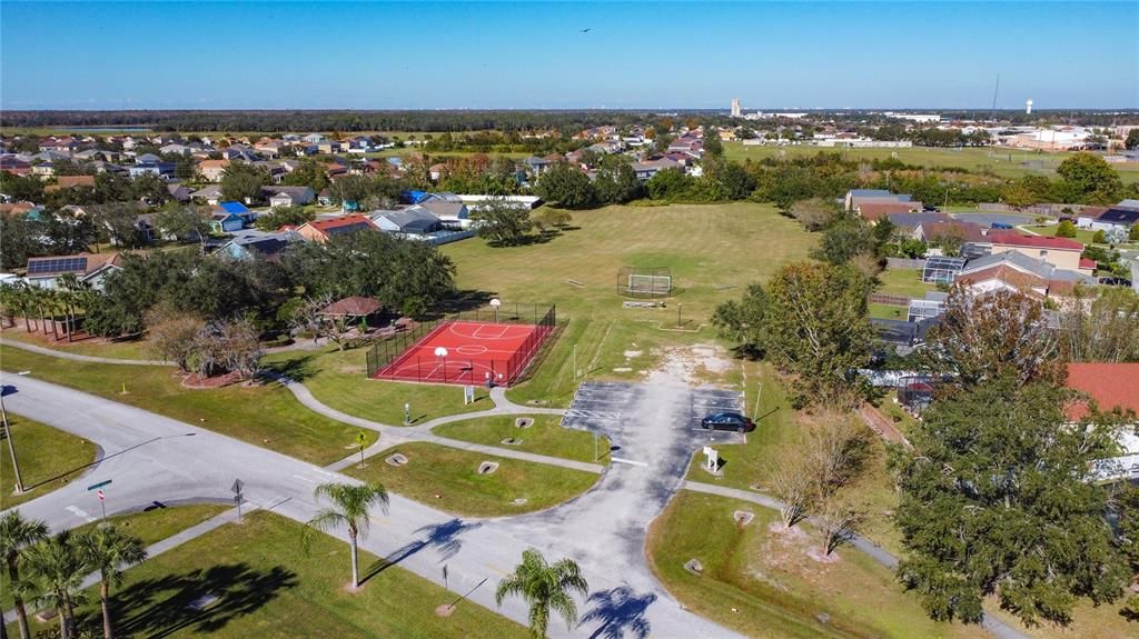 The basketball court and soccer field are located toward the front of the community.