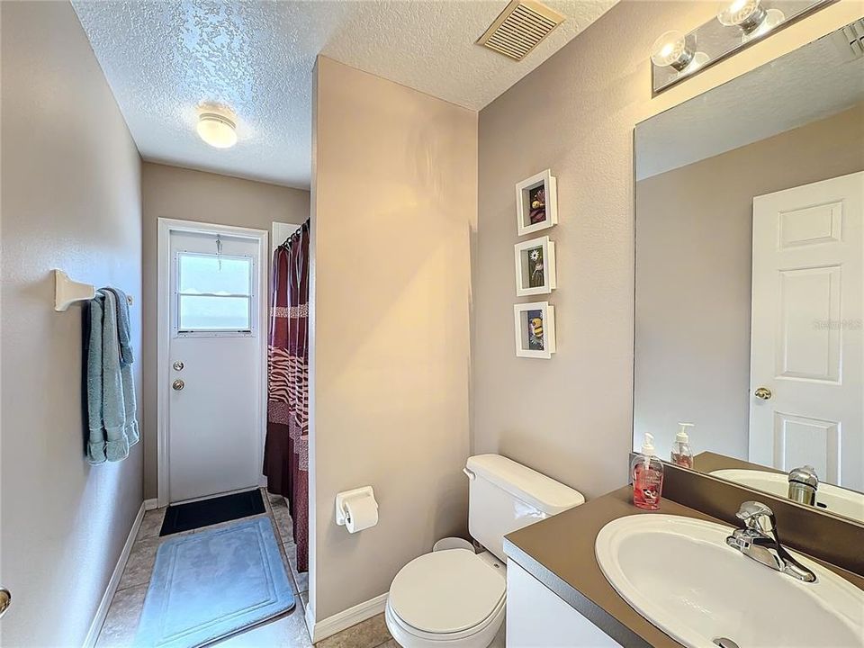 The guest bathroom allows access from the pool.