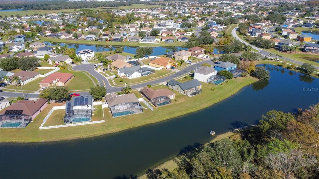 An aerial view of the pond located at the rear of the property.