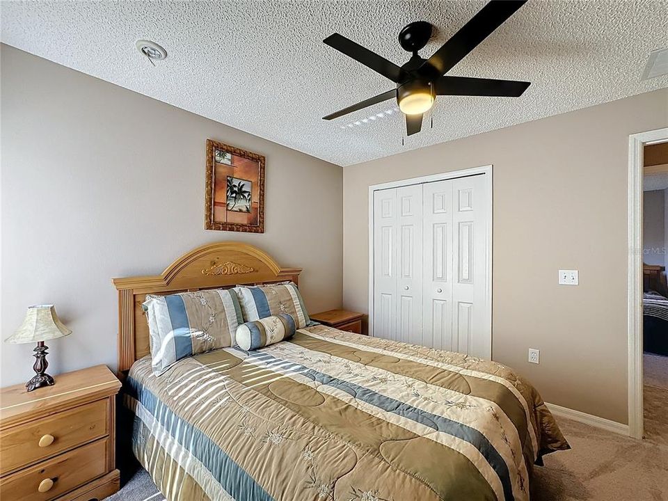 The guest bedroom is carpeted.