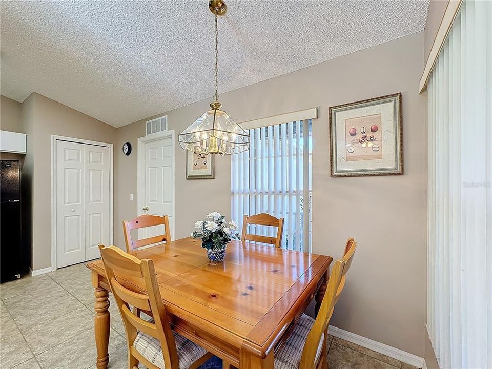 The kitchen table located by the two windows at the front of the house.