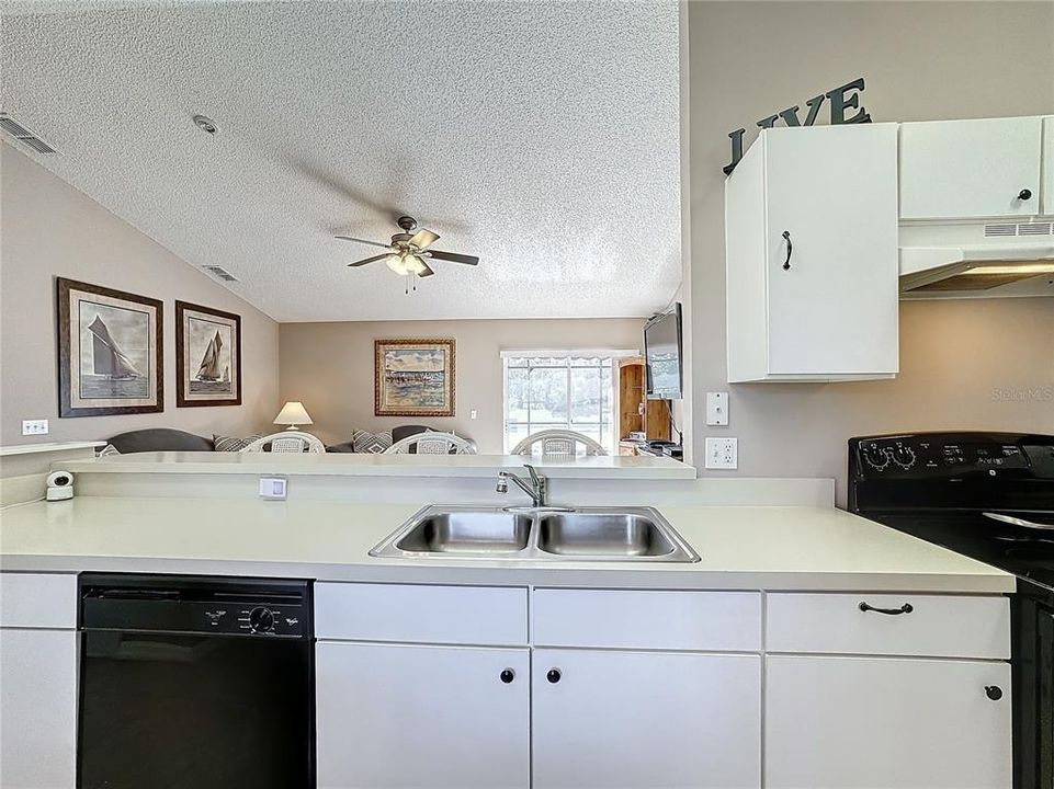 There is eating space in the kitchen and at the breakfast bar.