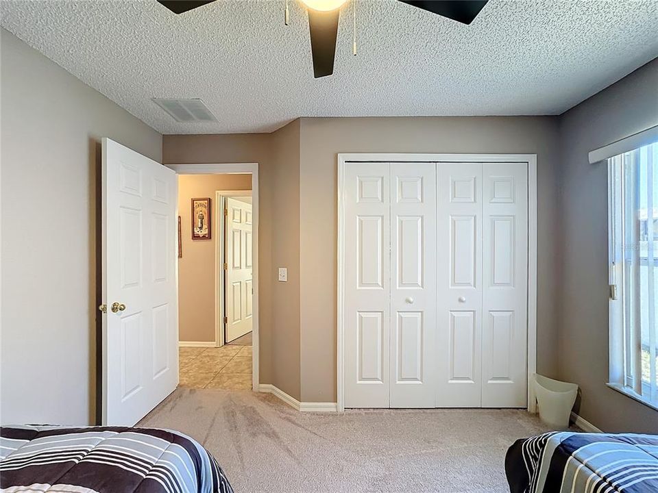 A view of the guest bedroom looking toward the hallway.