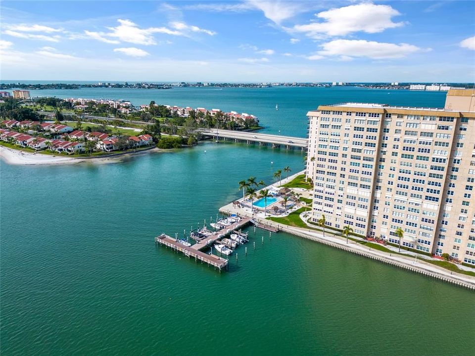 View of a 3rd community pool and community dock with boat slips.  Aerial view facing northwest