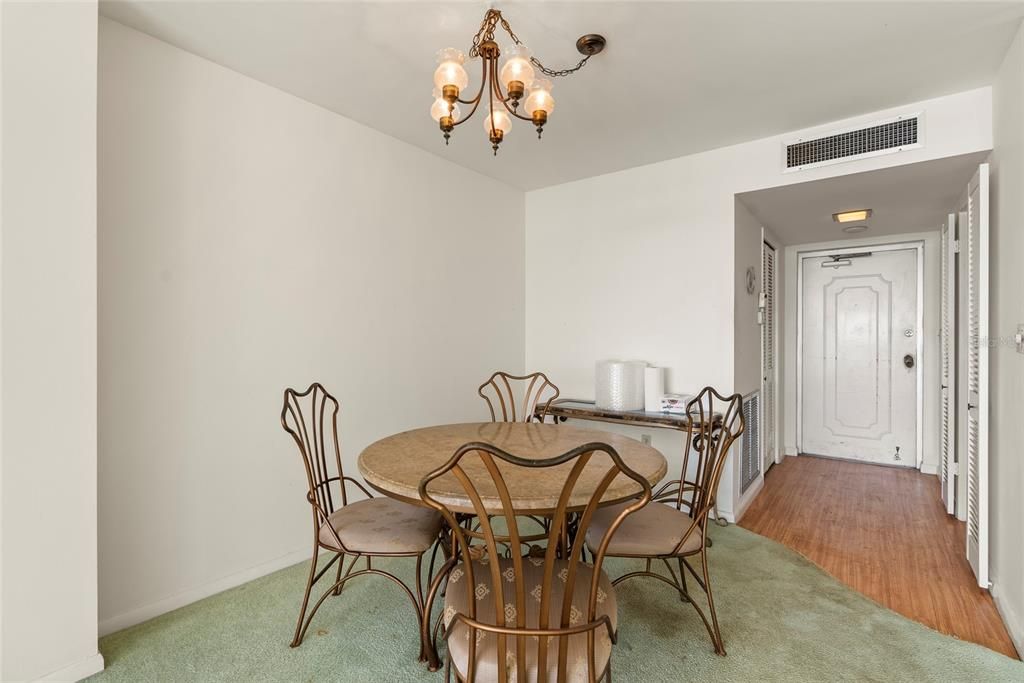 Dining room.  The door in this photo is the entrance from the hall.  From this vantage point, there is a storage closet to the left of the front door and the entrance to the kitchen is on the right