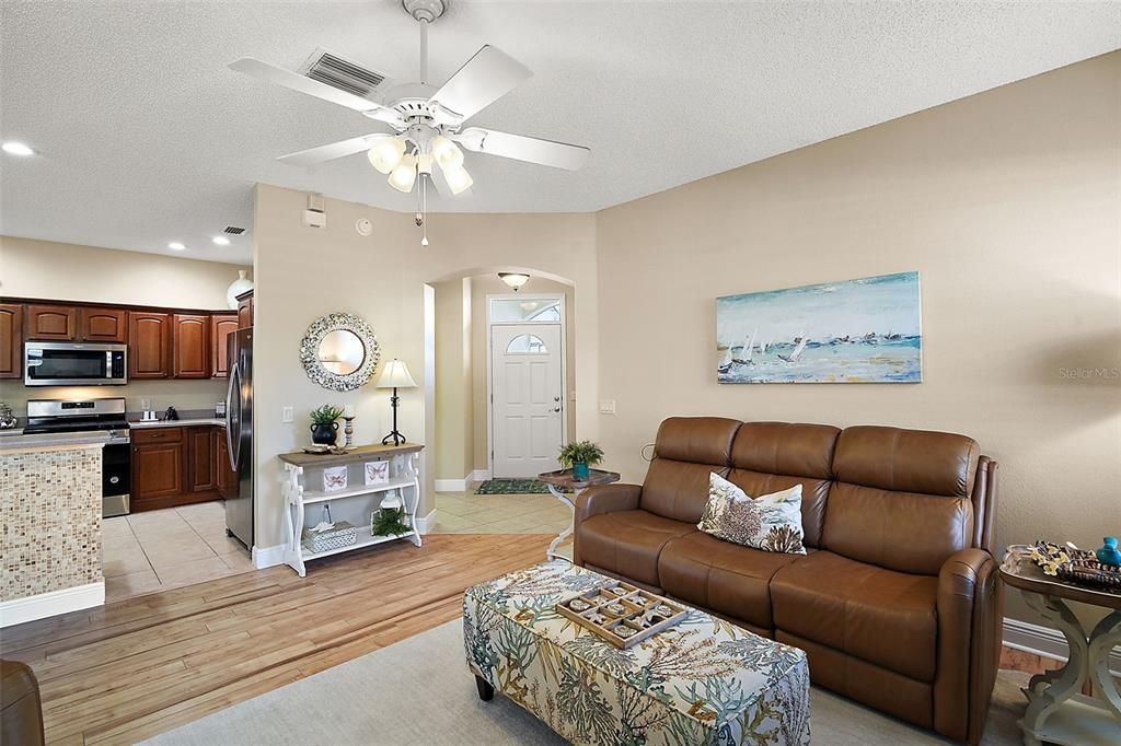 Living room, looking toward the front entry and kitchen