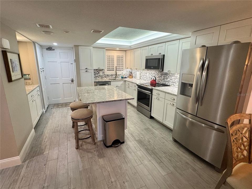 Custom Designer Kitchen with large island and coffee bar