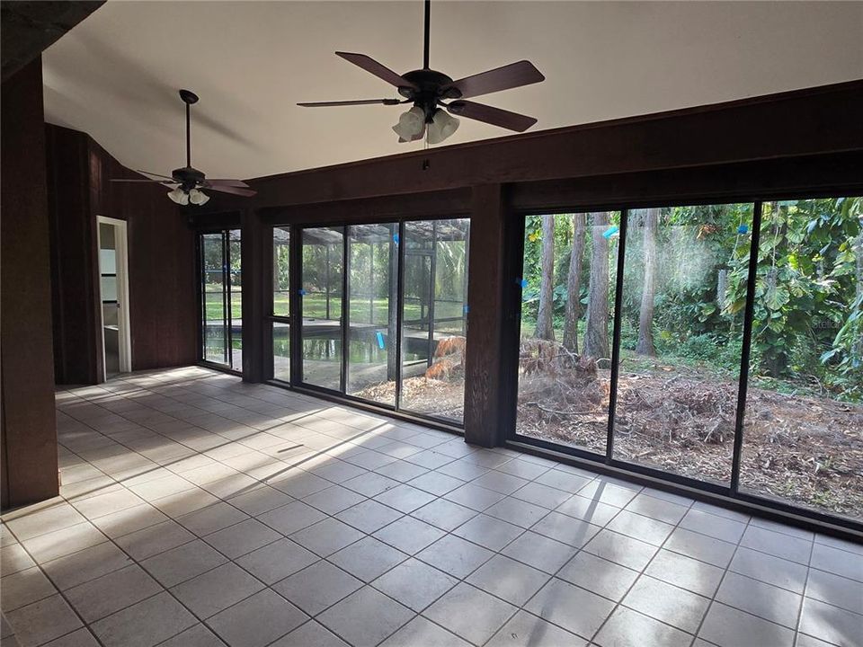 enclosed Florida room leading to the pool and back yard