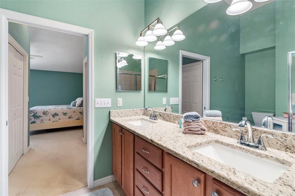 Primary bathroom with dual vanity.